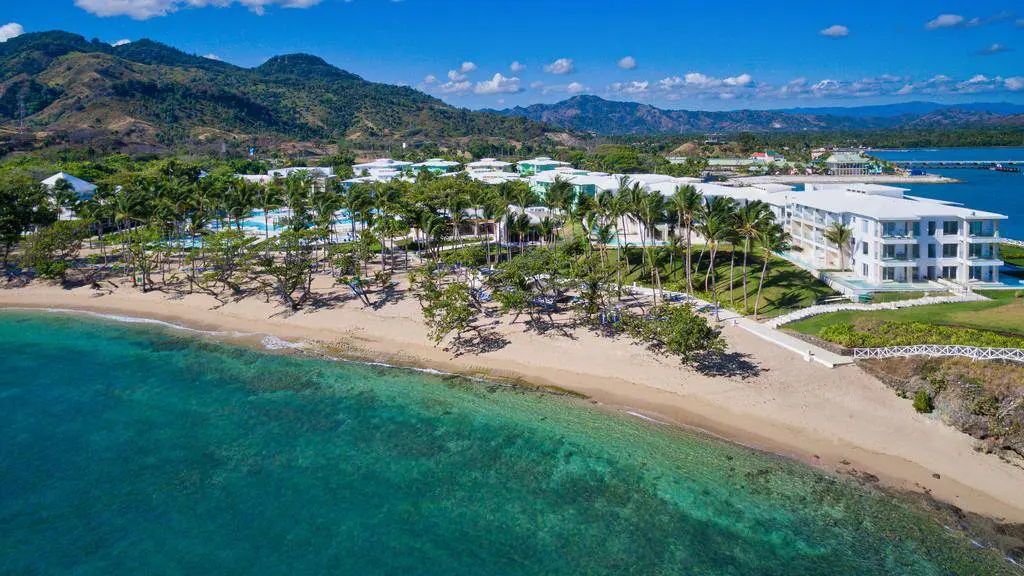 an aerial view of a resort on the beach.